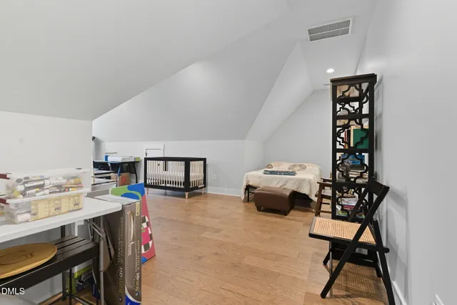 an aerial view of a residential houses with city view