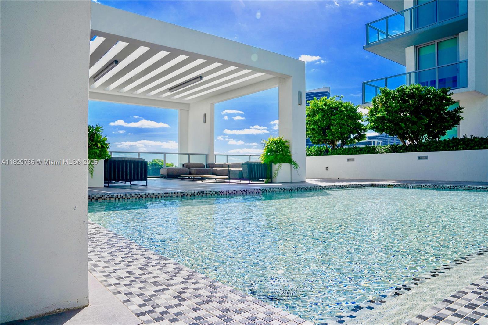 3900 Biscayne Boulevard, Unit S818 Miami, FL 33137 - Photo 12 of 32 a view of swimming pool with outdoor seating
