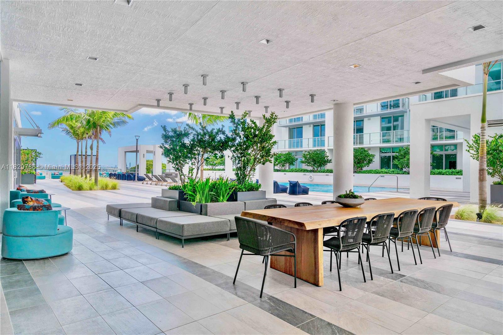 3900 Biscayne Boulevard, Unit S818 Miami, FL 33137 - Photo 18 of 32 a view of a dining hall with furniture and a potted plant