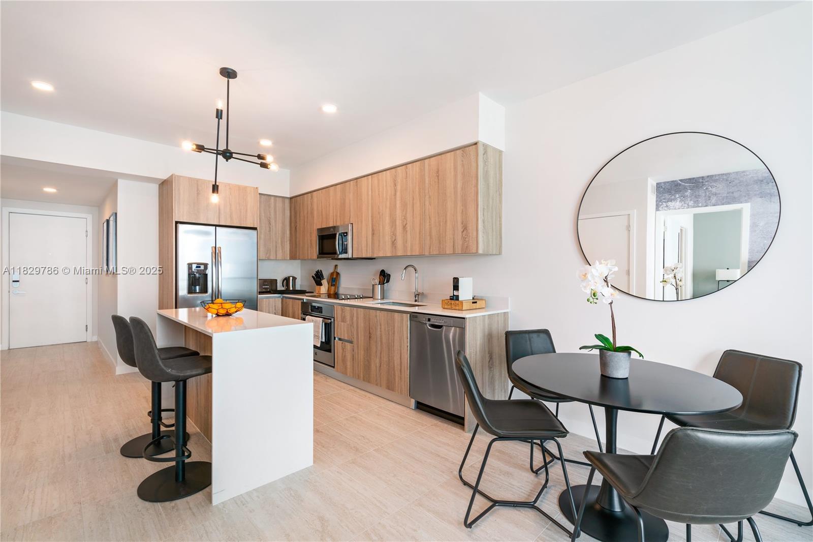 3900 Biscayne Boulevard, Unit S818 Miami, FL 33137 - Photo 4 of 32 a view of a dining room with furniture window and wooden floor