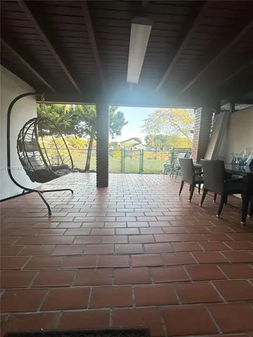 a view of a porch with furniture
