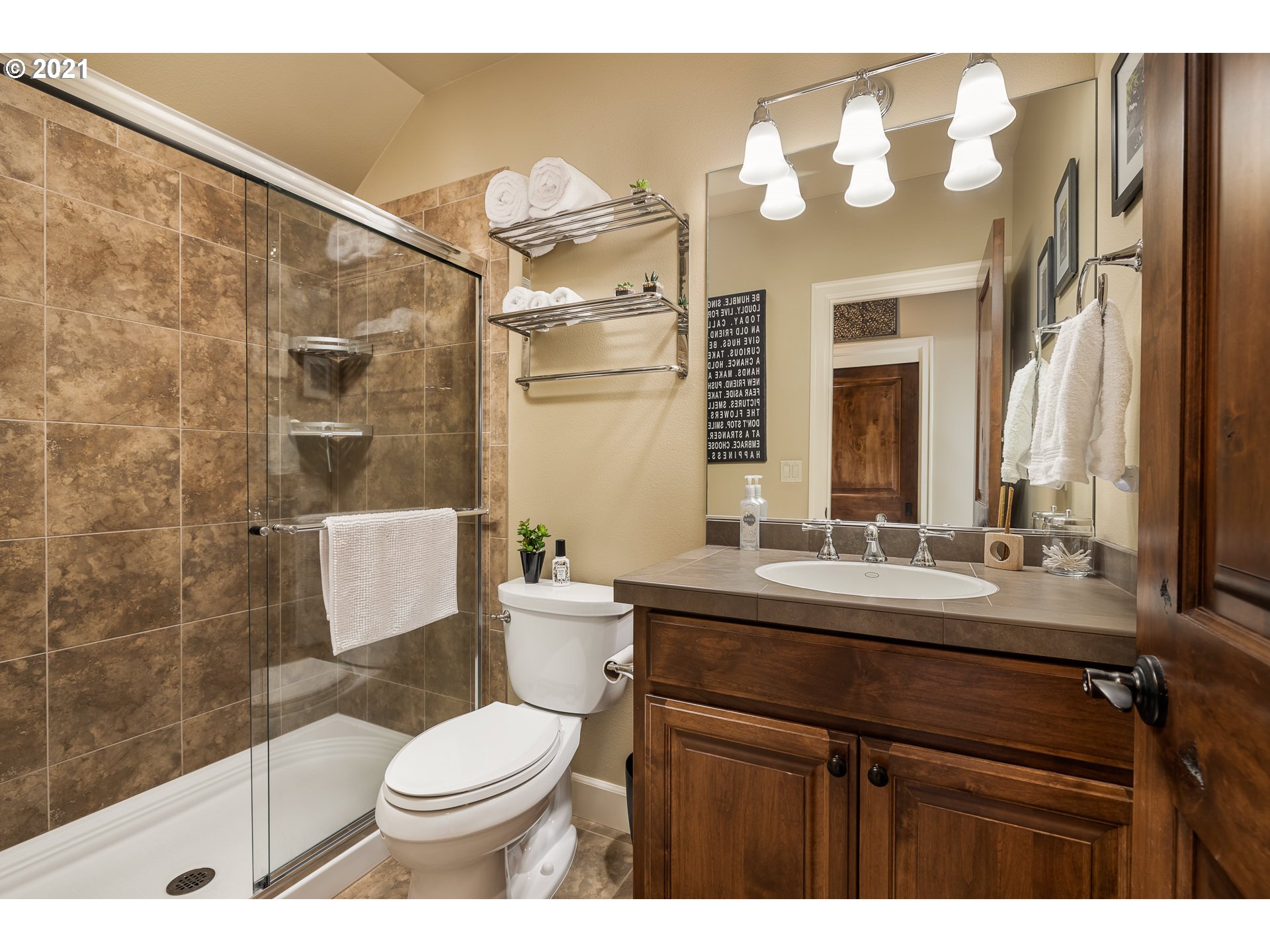 20484 South Springwater Road Estacada, OR 97023 - Photo 14 of 32 a bathroom with a sink a toilet a mirror and shower