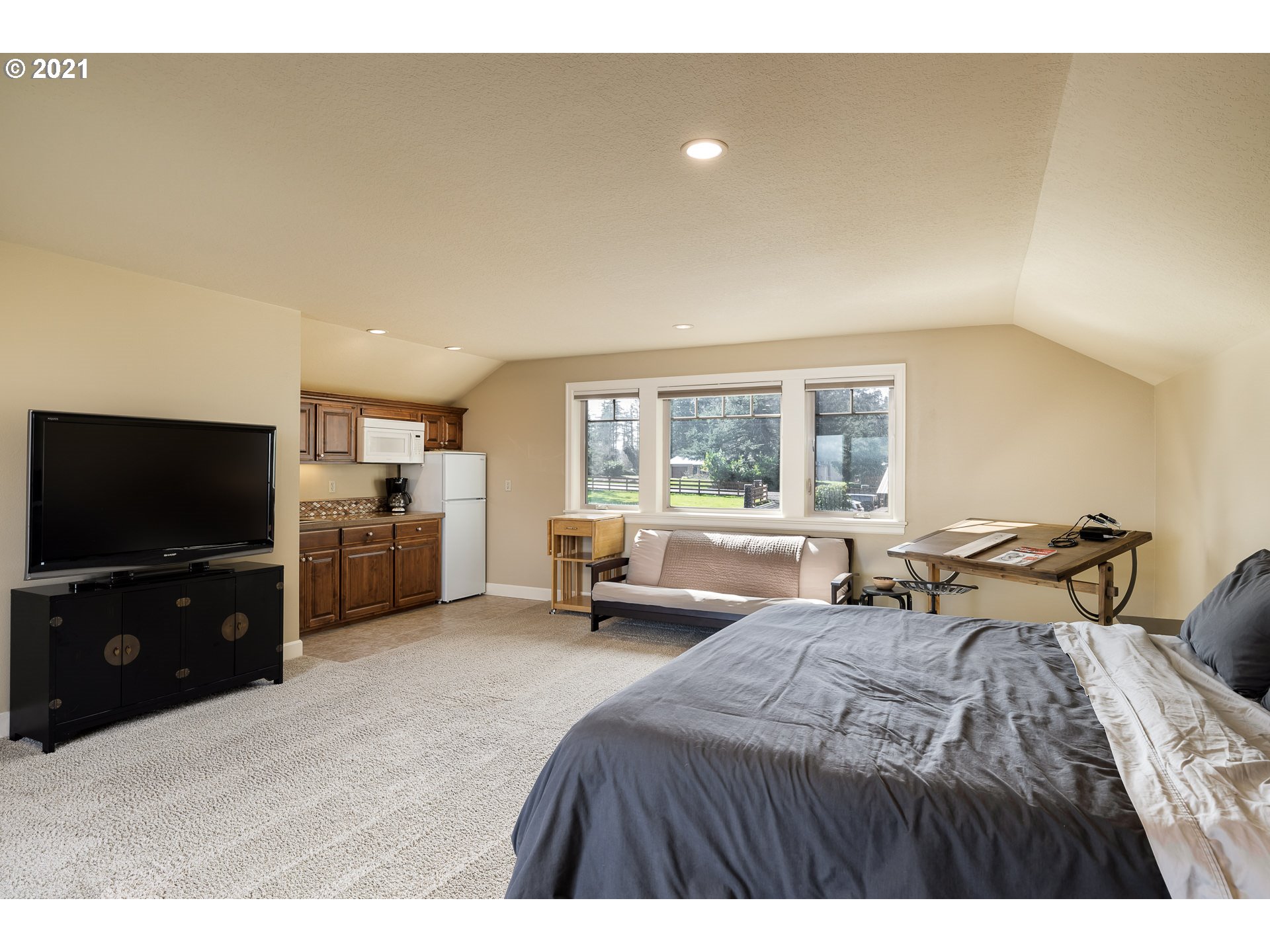 20484 South Springwater Road Estacada, OR 97023 - Photo 25 of 32 a bedroom with furniture and a flat screen tv