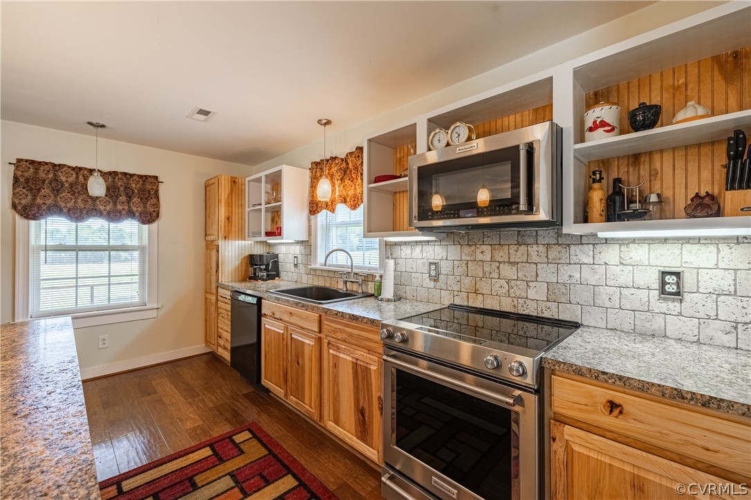 60 Rodeo Lane Dillwyn, VA 23936 - Photo 11 of 45 a kitchen with stainless steel appliances granite countertop a stove a sink and a microwave