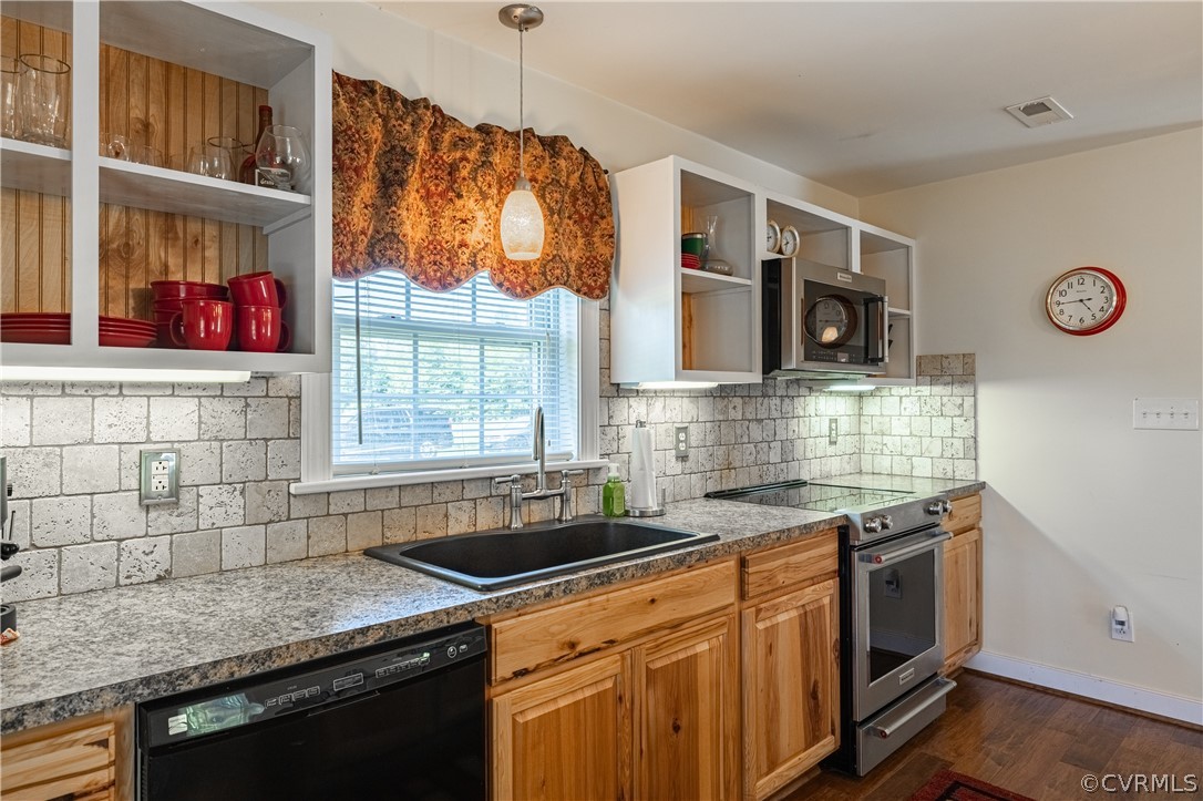 60 Rodeo Lane Dillwyn, VA 23936 - Photo 17 of 45 a kitchen with stainless steel appliances granite countertop a sink a stove a microwave a refrigerator and cabinets