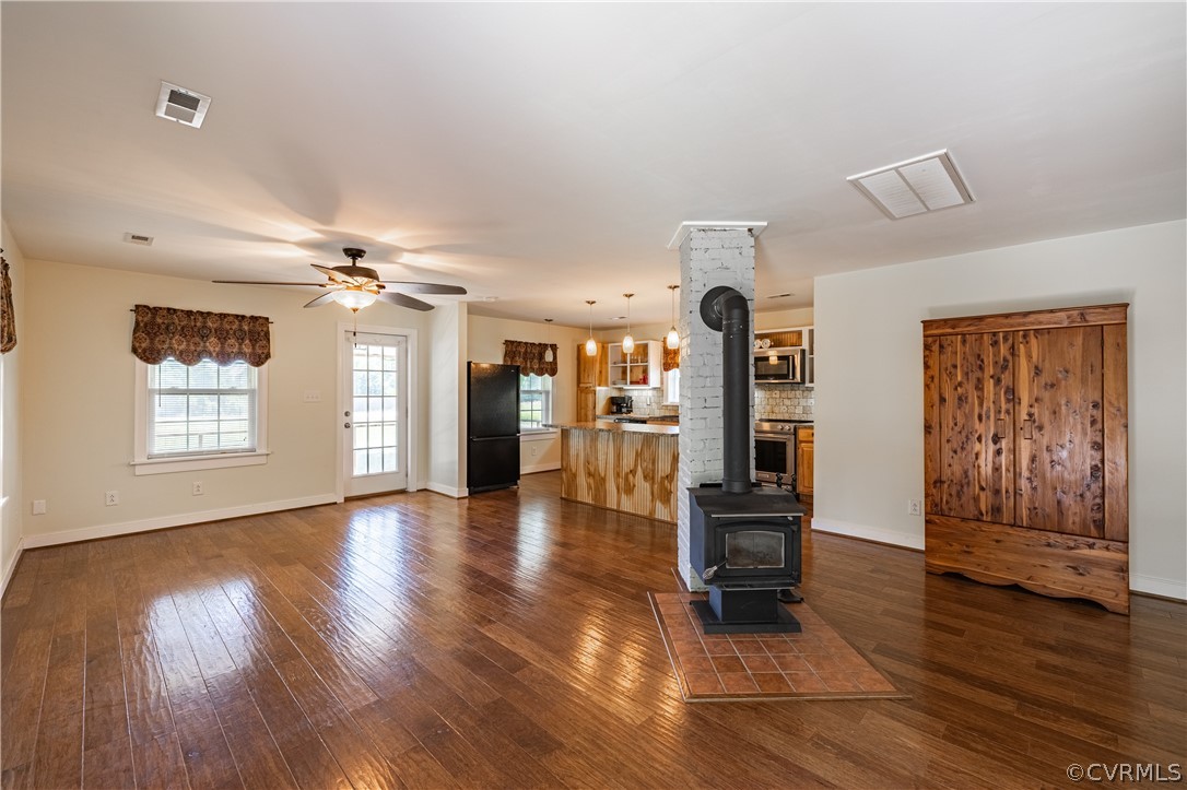 60 Rodeo Lane Dillwyn, VA 23936 - Photo 6 of 45 a view of a livingroom with wooden floor and a ceiling fan