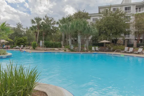 a view of a swimming pool with a yard