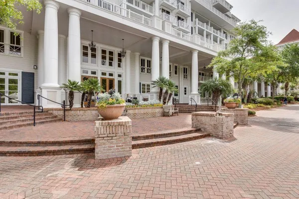 a view of a building with sitting area