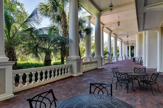 a view of a chairs and tables in the patio