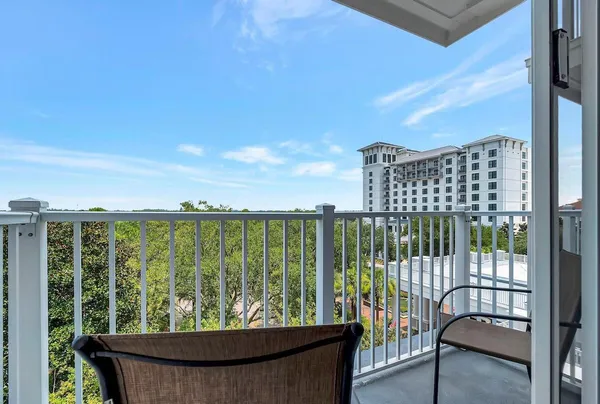 a view of a balcony with an ocean view