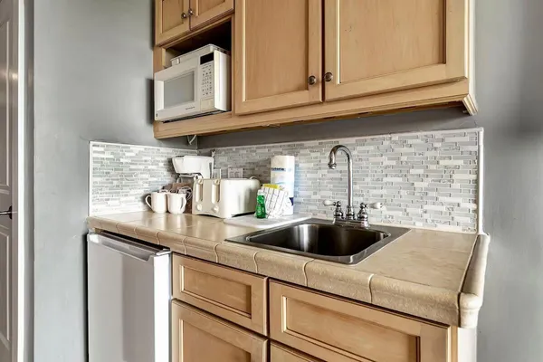 a kitchen with a sink and cabinets