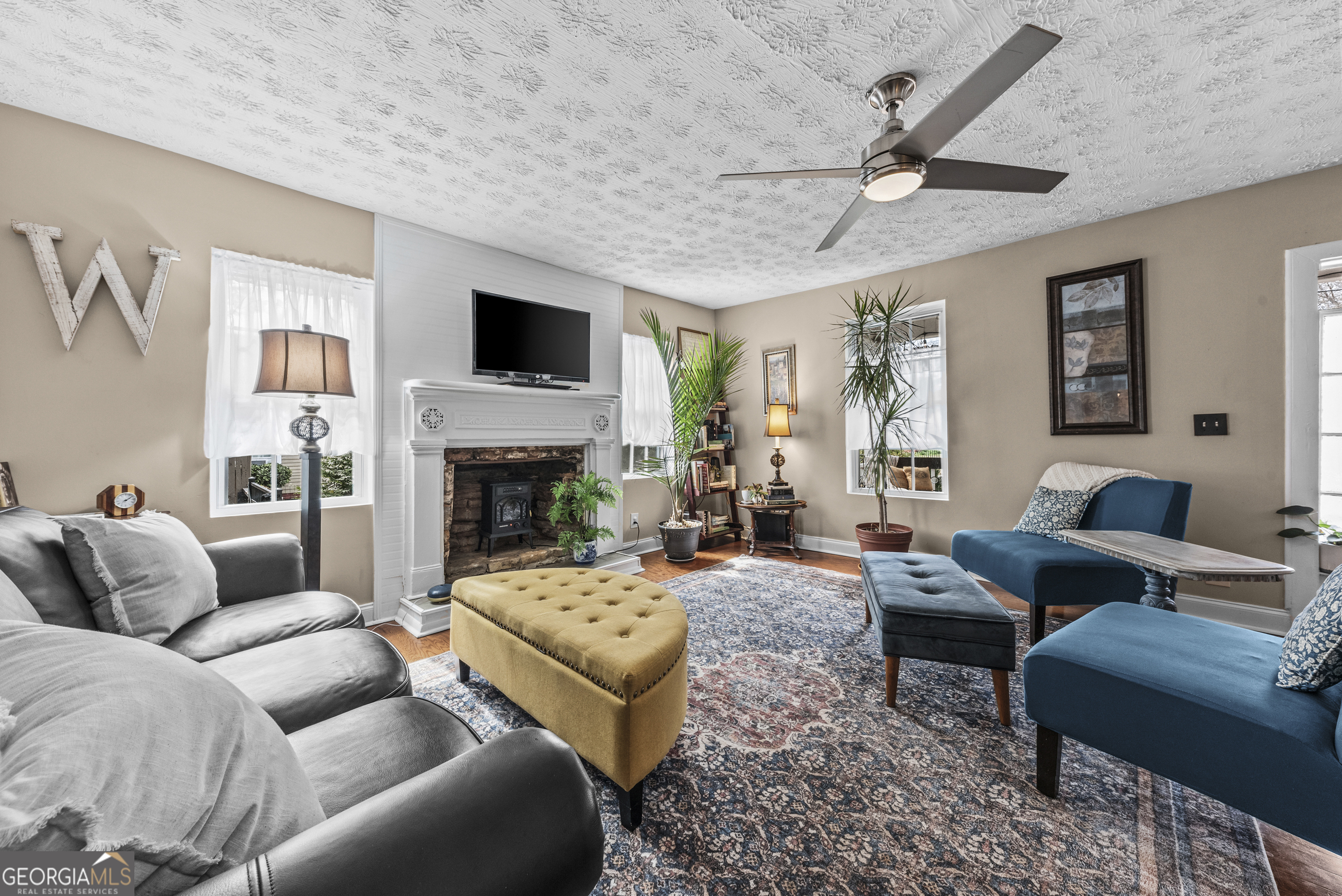 178 Fairplay Street Rutledge, GA 30663 - Photo 20 of 54 a living room with furniture and a fireplace