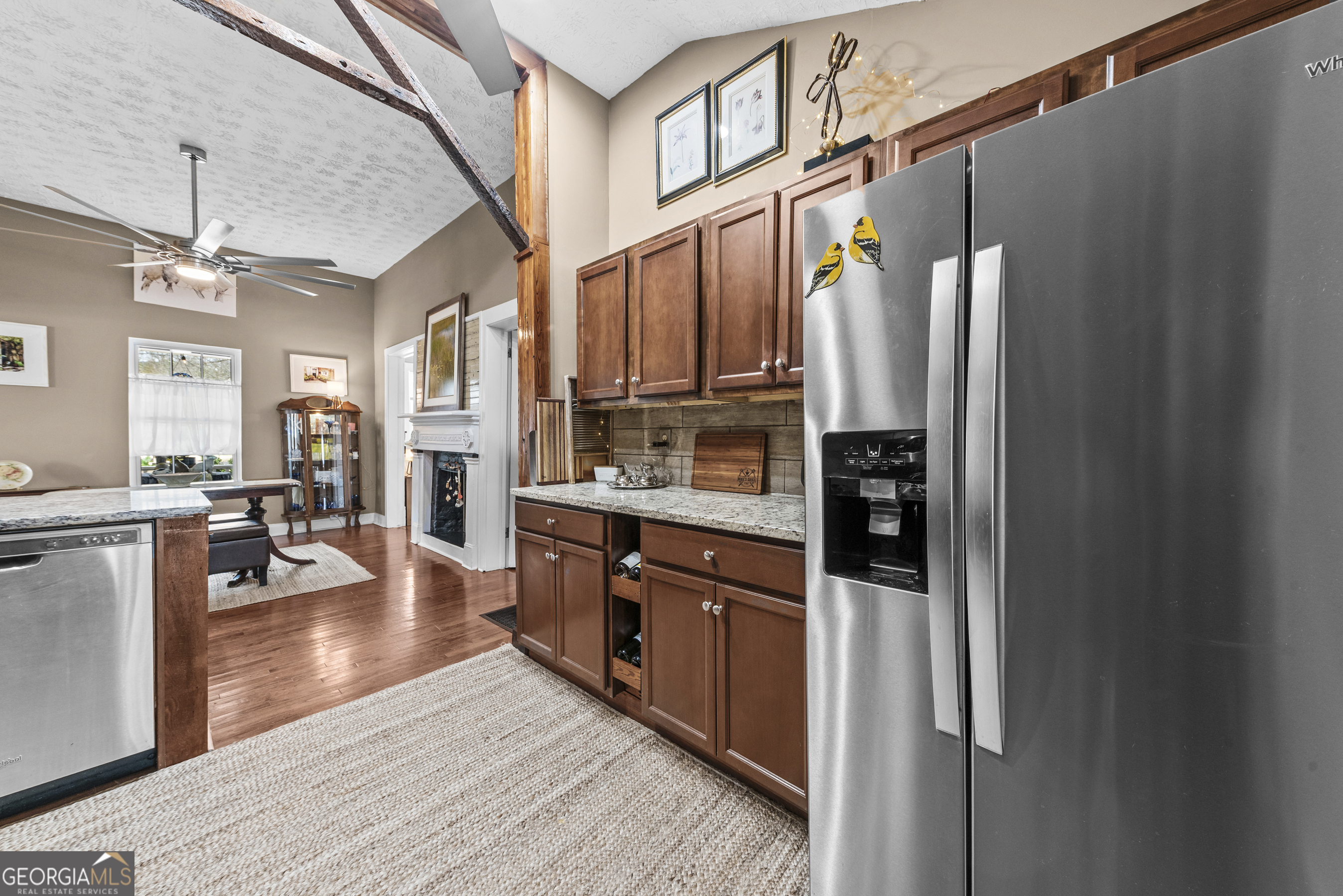 178 Fairplay Street Rutledge, GA 30663 - Photo 24 of 54 a kitchen with stainless steel appliances granite countertop a refrigerator a stove and a wooden floors