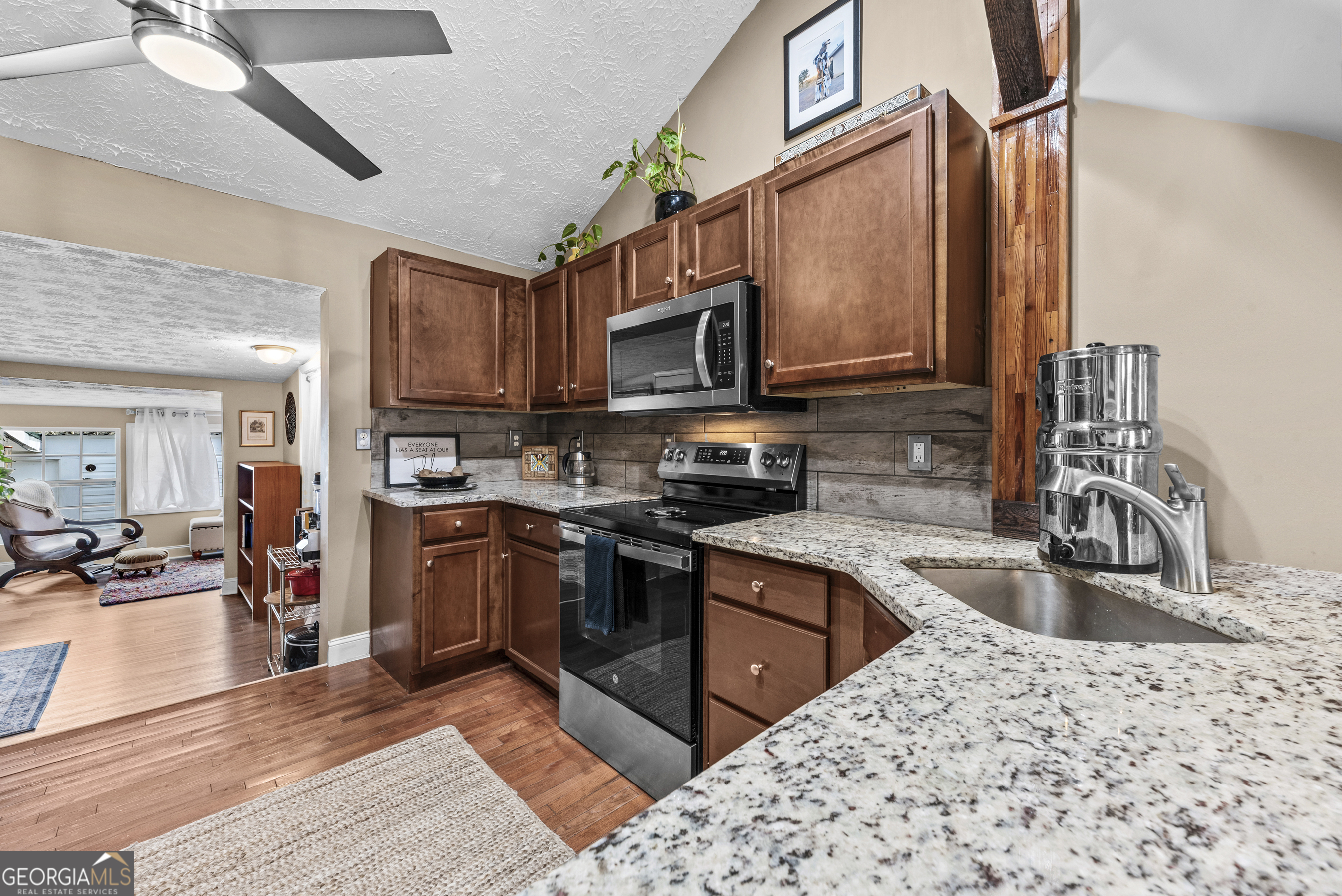 178 Fairplay Street Rutledge, GA 30663 - Photo 28 of 54 a kitchen with stainless steel appliances granite countertop a sink stove and refrigerator