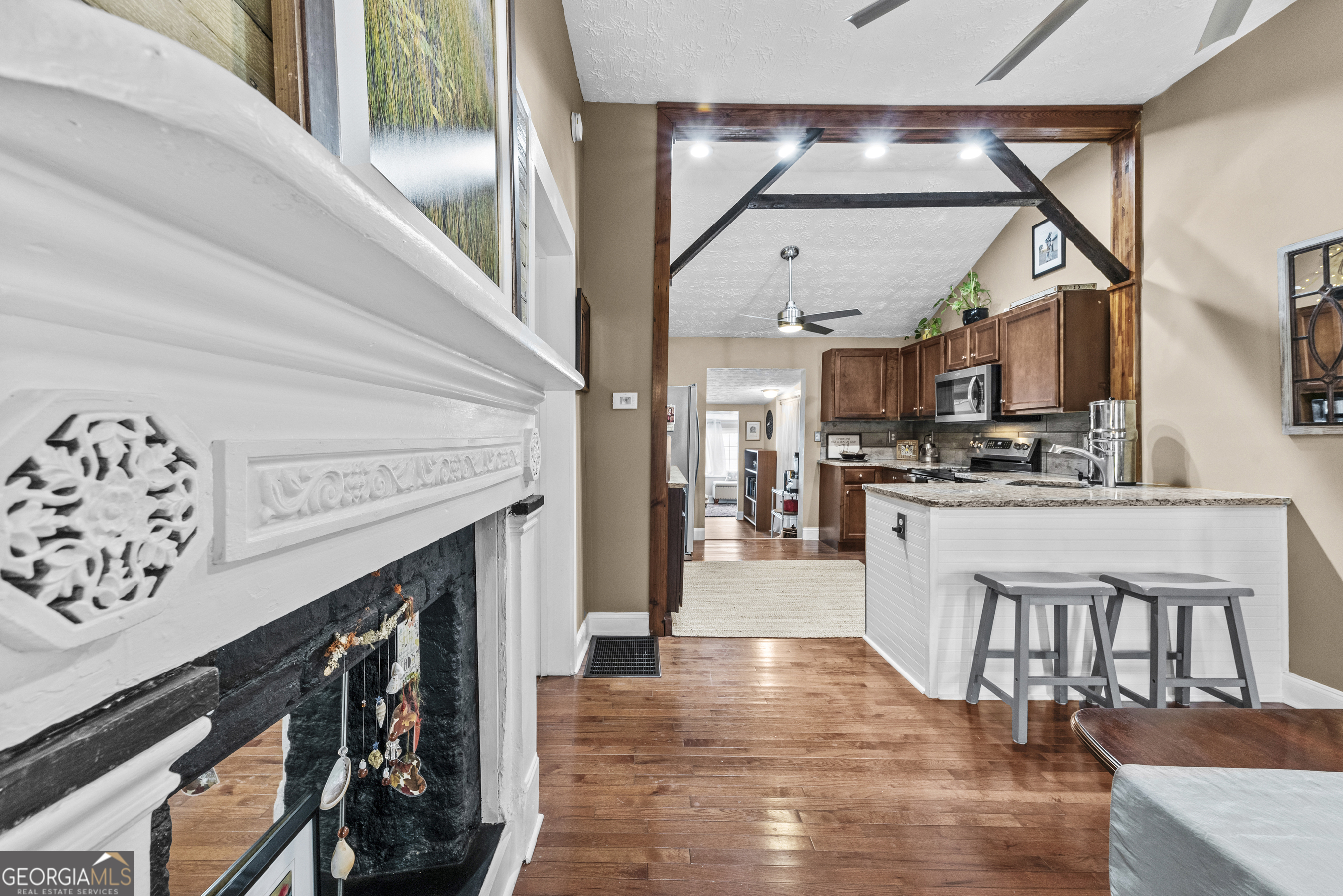 178 Fairplay Street Rutledge, GA 30663 - Photo 31 of 54 a open kitchen with white cabinets and stainless steel appliances