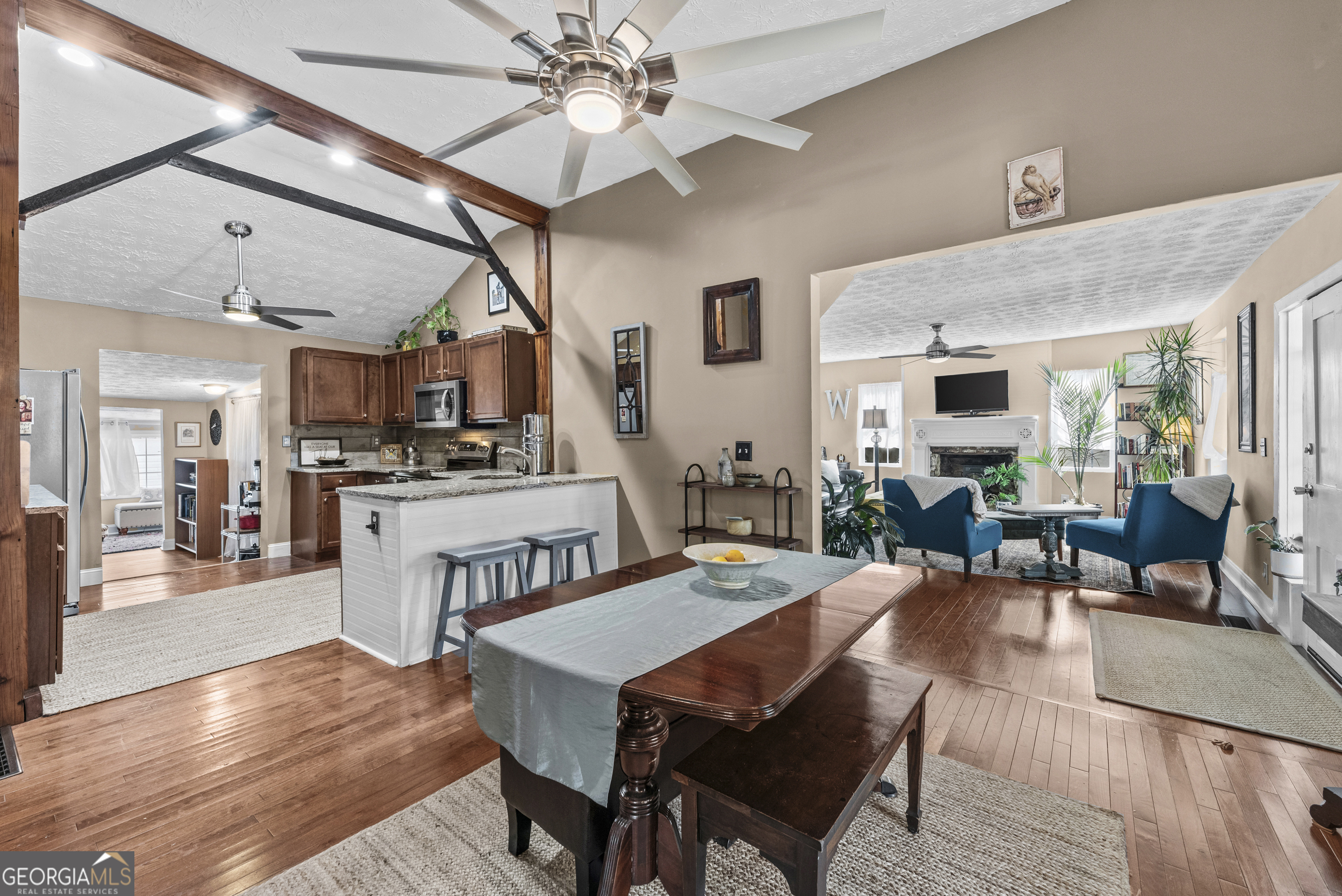 178 Fairplay Street Rutledge, GA 30663 - Photo 32 of 54 a view of a dining room with furniture a kitchen and chandelier