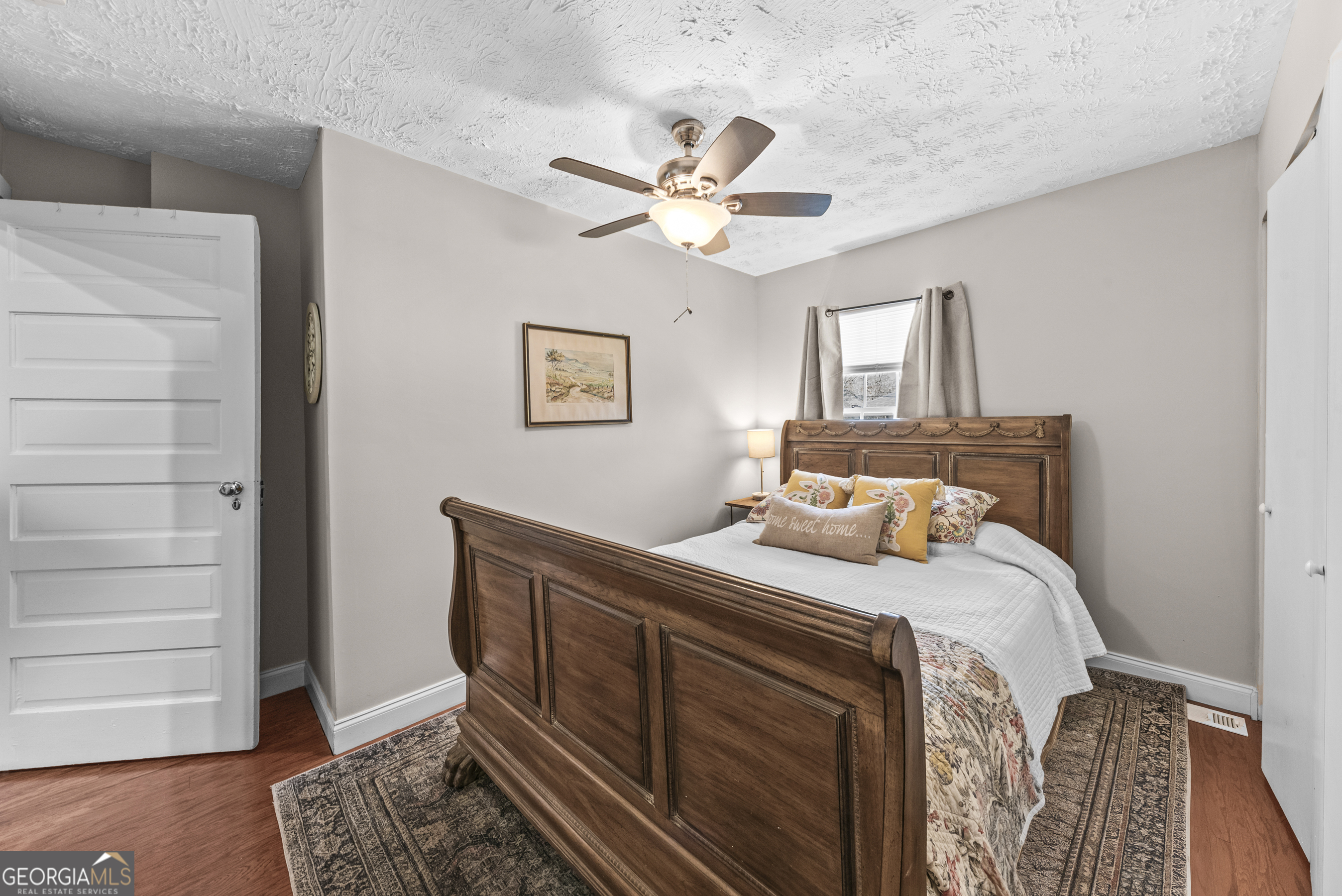178 Fairplay Street Rutledge, GA 30663 - Photo 41 of 54 a bedroom with a bed and a window