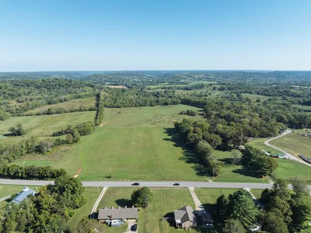 an aerial view of a houses with outdoor space