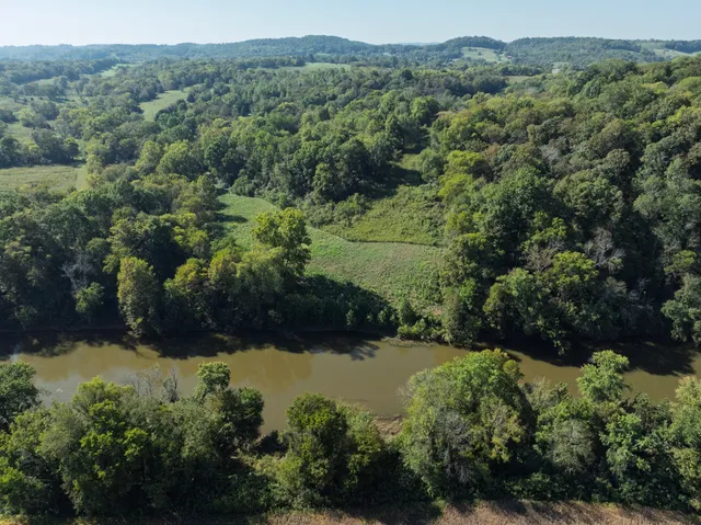 an aerial view of valley and lake