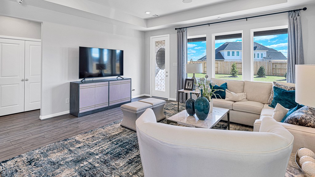 1202 Buffalo Run Tomball, TX 77375 - Photo 16 of 45 a living room with furniture and a flat screen tv