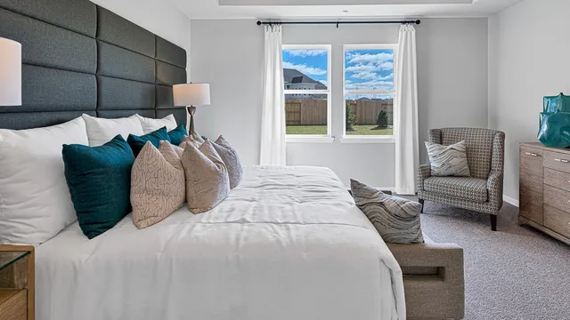 a bedroom with a bed and a couch