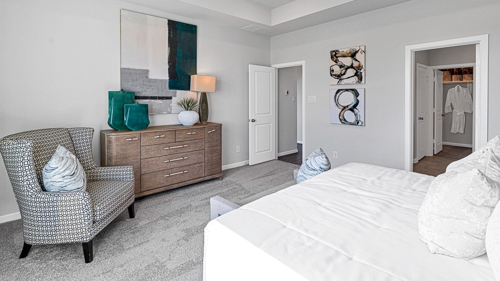 1202 Buffalo Run Tomball, TX 77375 - Photo 23 of 45 a bedroom with a bed and a couch