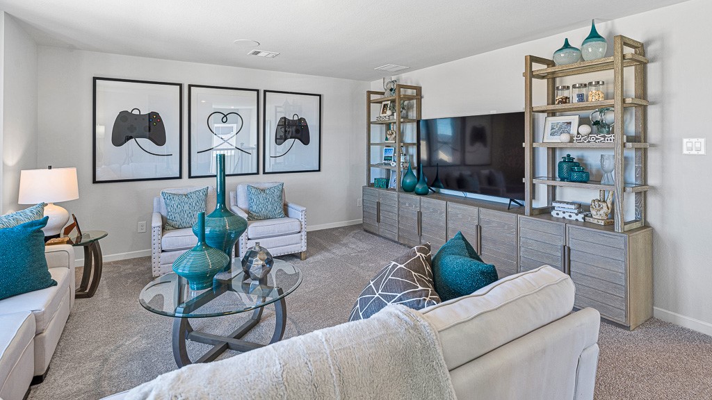 1202 Buffalo Run Tomball, TX 77375 - Photo 32 of 45 a living room with furniture and a flat screen tv