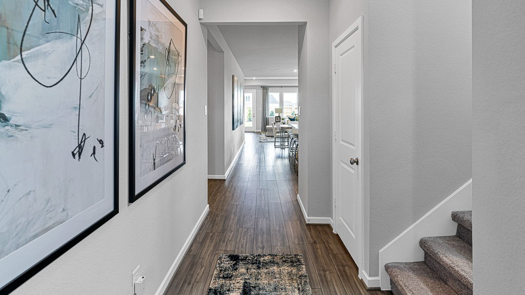1202 Buffalo Run Tomball, TX 77375 - Photo 4 of 45 a view of a hallway with wooden floor and staircase