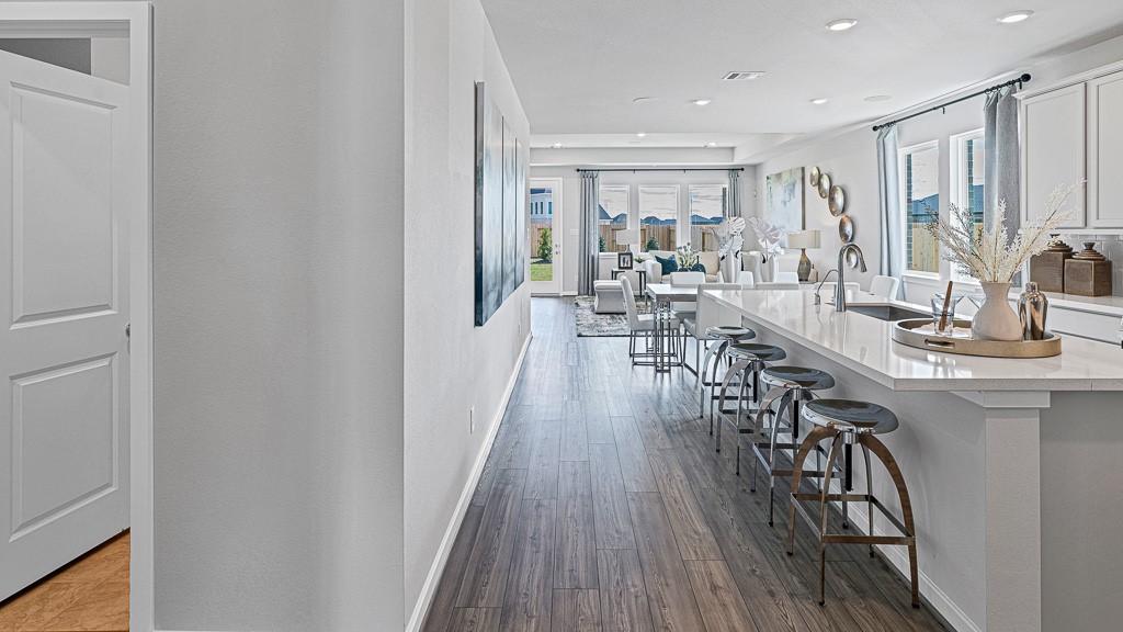 1202 Buffalo Run Tomball, TX 77375 - Photo 6 of 45 a view of a dining room with furniture window and wooden floor