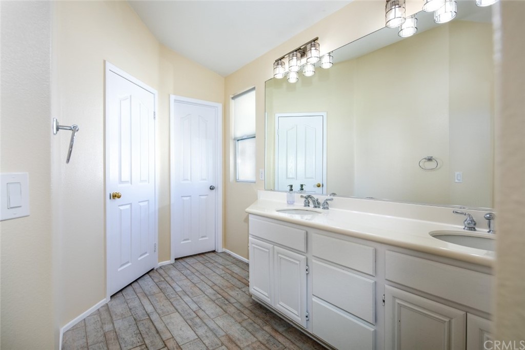 1 Quebec Aliso Viejo, CA 92656 - Photo 16 of 40 a bathroom with a double vanity sink and mirror
