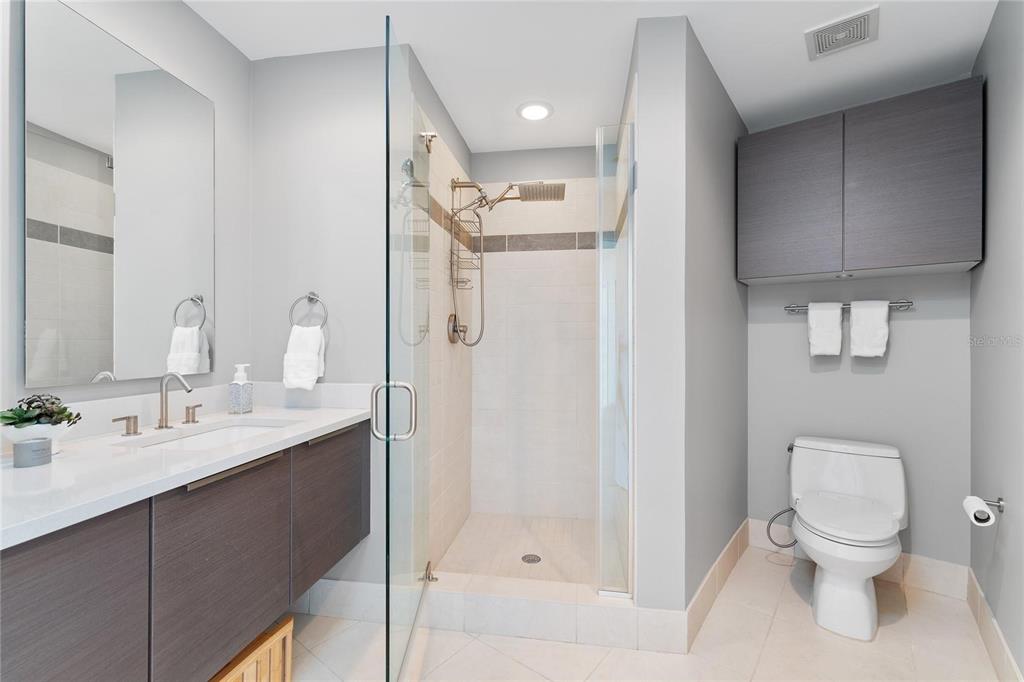 175 1st Street South, Unit 406 St. Petersburg, FL 33701 - Photo 18 of 42 a bathroom with a sink a toilet and shower