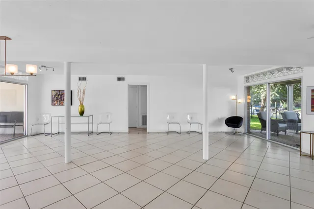 an empty room with table and chair