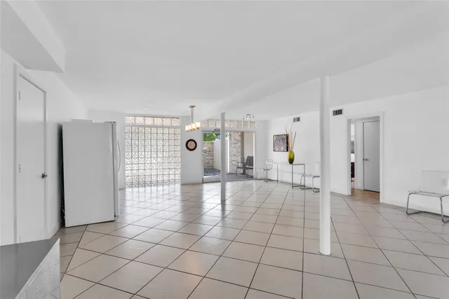 a kitchen with cabinets and white appliances