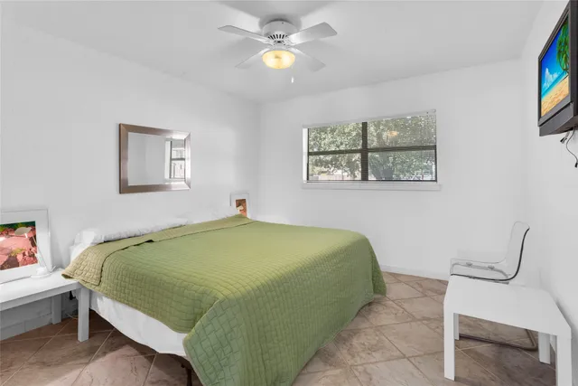 a living room with a couch and a chandelier