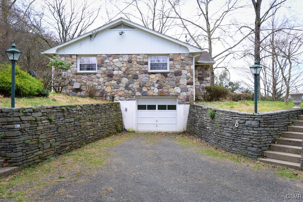 1177 Beaver Valley Road Stroudsburg, PA 18360 - Photo 15 of 46 a front view of a house with a yard and garage