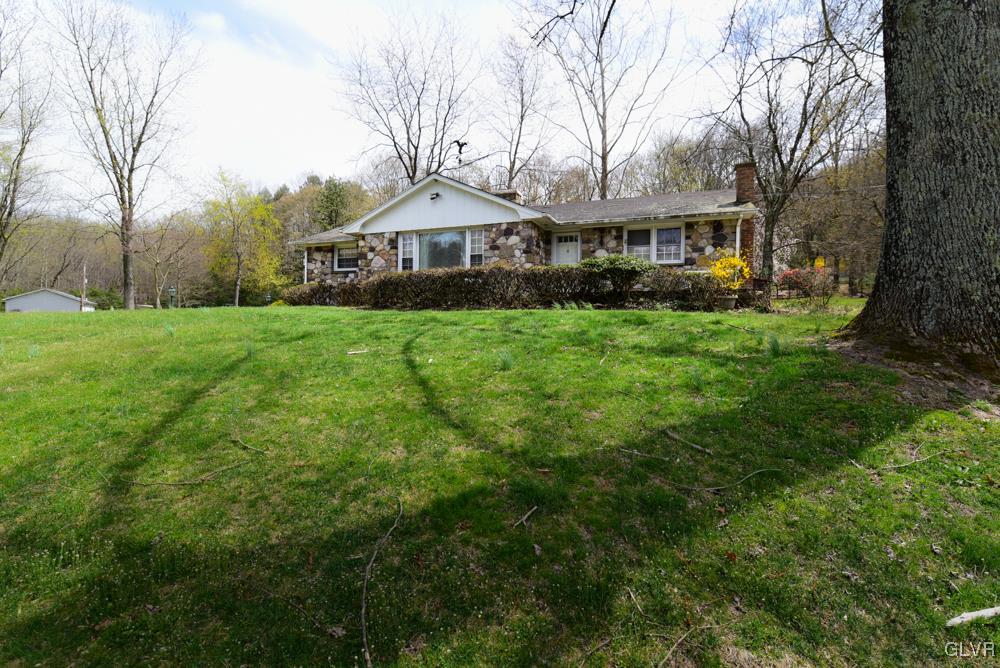 1177 Beaver Valley Road Stroudsburg, PA 18360 - Photo 2 of 46 a front view of a house with yard and green space