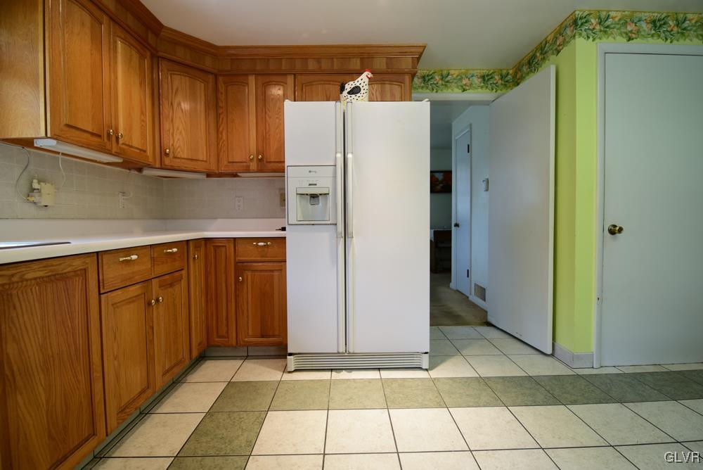 1177 Beaver Valley Road Stroudsburg, PA 18360 - Photo 21 of 46 a kitchen with a refrigerator and cabinets
