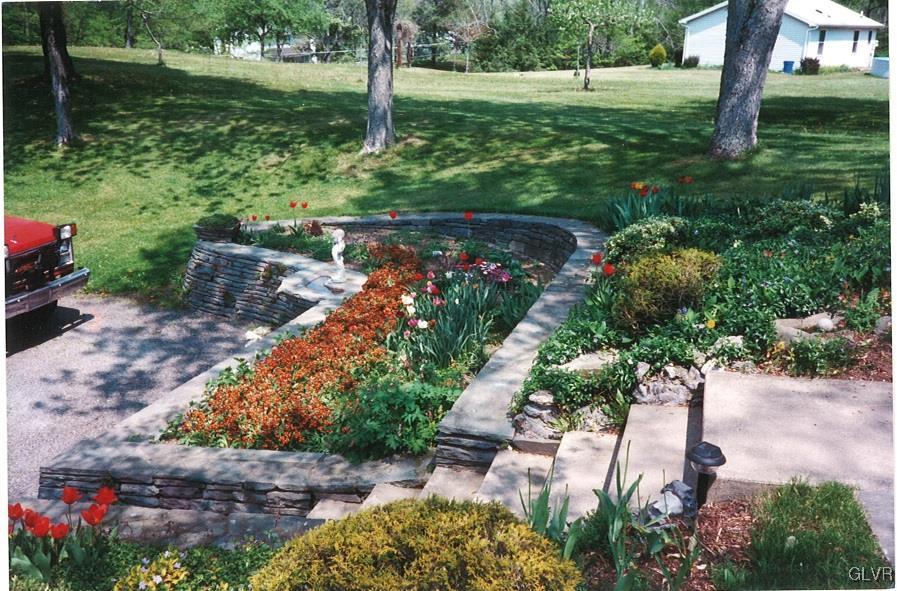 1177 Beaver Valley Road Stroudsburg, PA 18360 - Photo 40 of 46 a view of a garden with a fountain