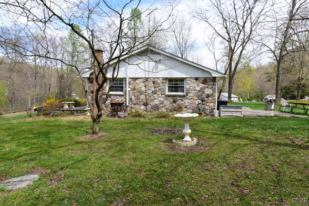1177 Beaver Valley Road Stroudsburg, PA 18360 - Photo 5 of 46 a front view of a house with garden