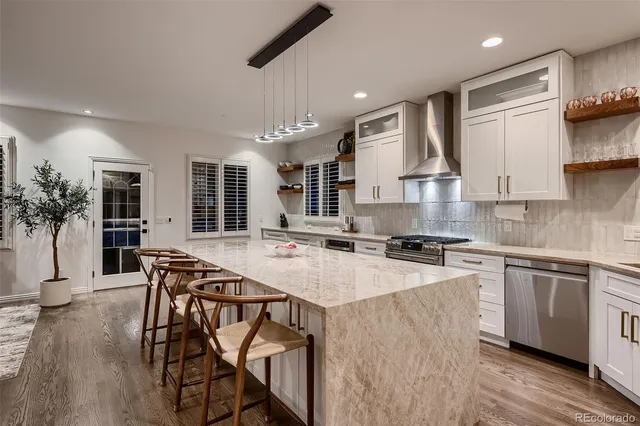 a white bath tub sitting in a bathroom next to a window