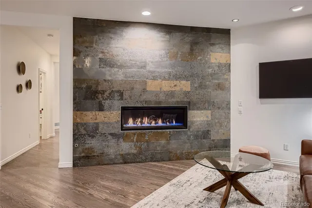 a workspace with furniture window and wooden floor