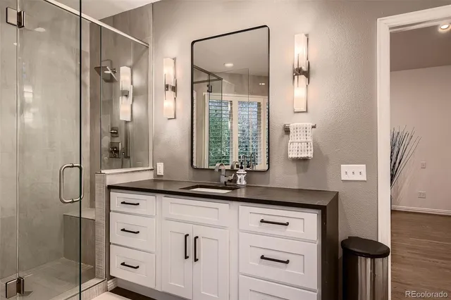 a view of kitchen with stainless steel appliances cabinets and large window