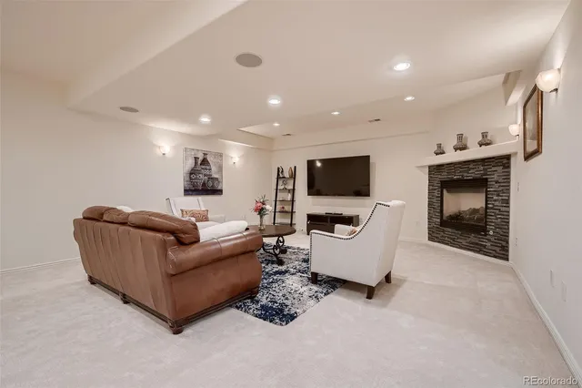 a sign of golf club on a wall under a tree