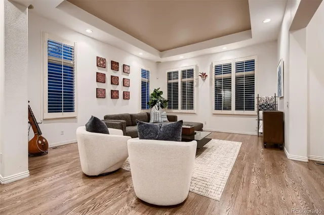 a kitchen with a wooden floor and cabinets