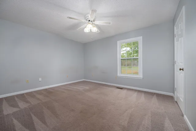 a view of an empty room with a garage