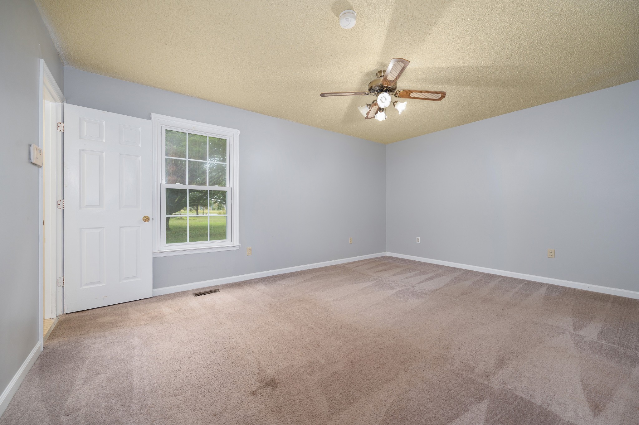 5665 Old Salem Road Rockvale, TN 37153 - Photo 37 of 41 an empty room with ceiling fan and window