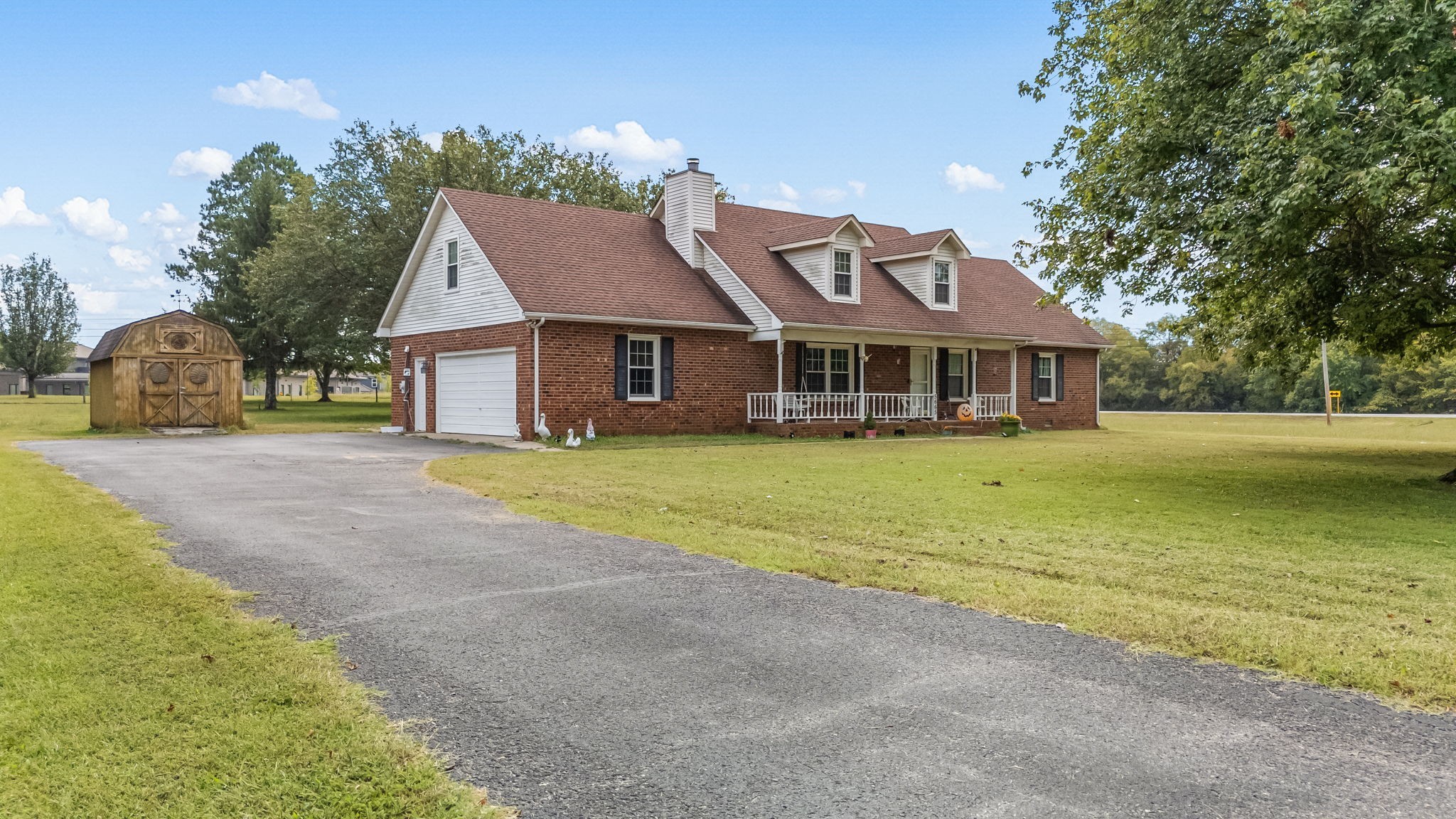 5665 Old Salem Road Rockvale, TN 37153 - Photo 5 of 41 a front view of a house with a garden and lake view