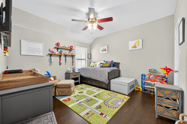 a bedroom with furniture and a chandelier