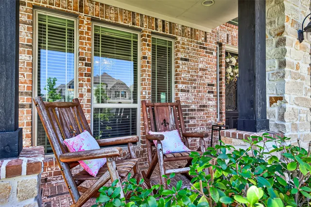 a view of an outdoor sitting area with furniture