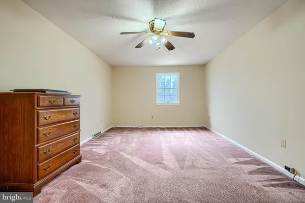 a view of empty room with windows